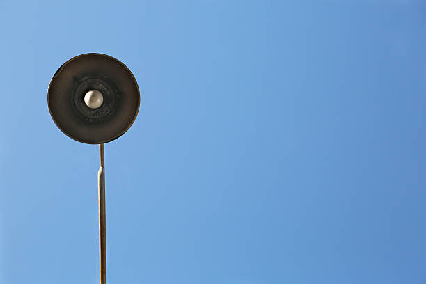 istock Old vintage street lamp against blue sky copy space 474842338