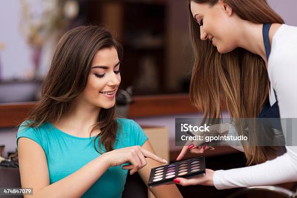 Woman With Makeup Artist Choosing Color Of Eyeshadow Stock Photo - Download Image Now