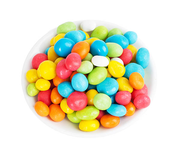 istock colored candies in white saucer 474848311