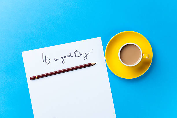 istock Cup of coffee and paper with inscription 474849468