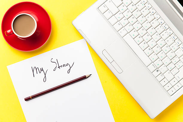 istock coffee and paper with My Story words near notebook 474853040