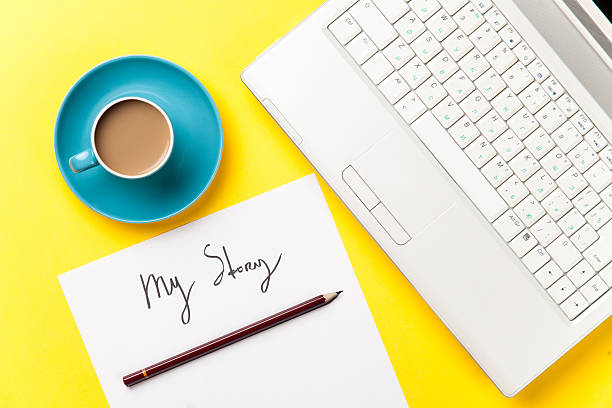 istock coffee and paper with My Story words near notebook 474853042