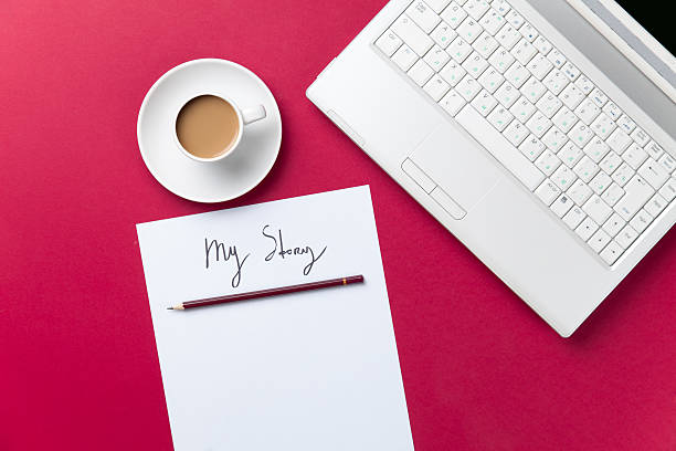 istock cup of coffee and computer with paper and pencil 474853098