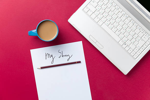 istock cup of coffee and computer with paper and pencil 474853100