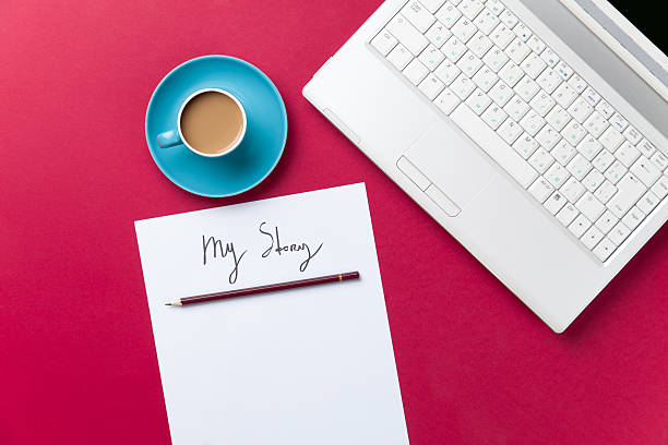 istock cup of coffee and computer with paper and pencil 474853106
