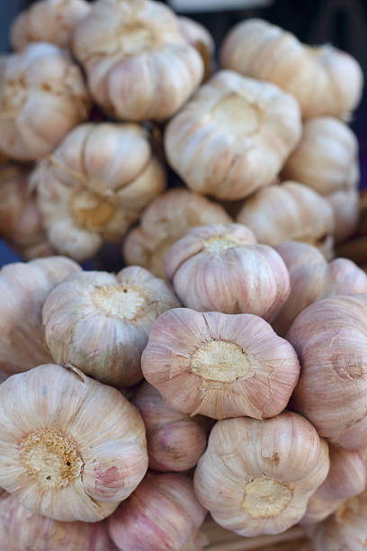 istock White garlic on a table at the market 474853818