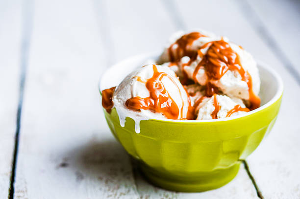 istock Vanilla ice-cream with caramel sauce on white background 474857355