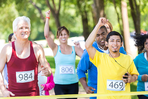 istock Young Hispanic man celebrating finishing marathon race 474857746