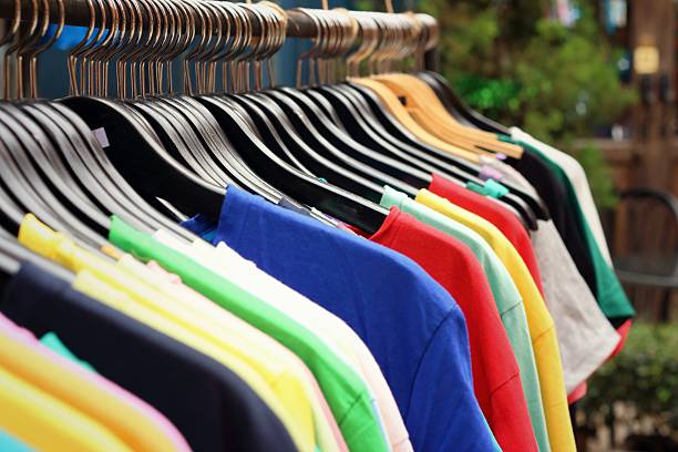 istock Shop shirts colorful fabric hanging on a rack. 474858118