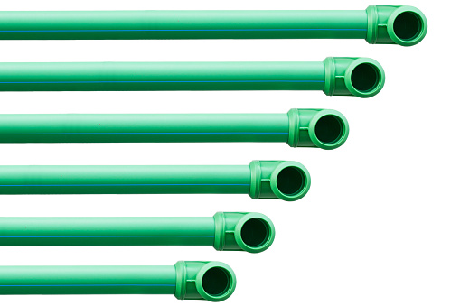 green plastic pipes isolated on white background