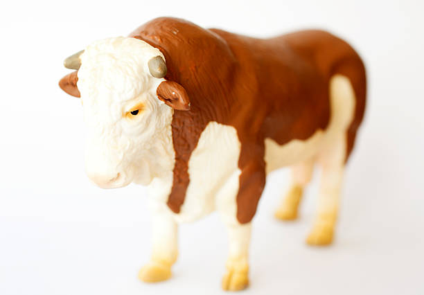 istock Toy cow isolated 474859226