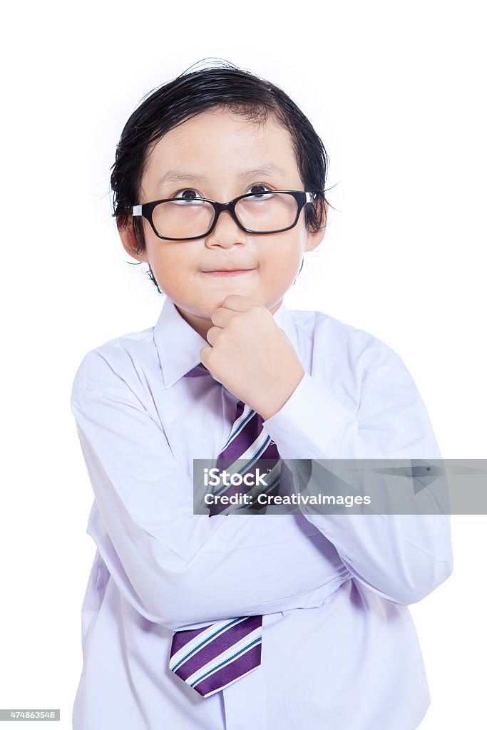 Close-up business kid thinking - isolated Close-up of business kid thinking on white background 2015 Stock Photo