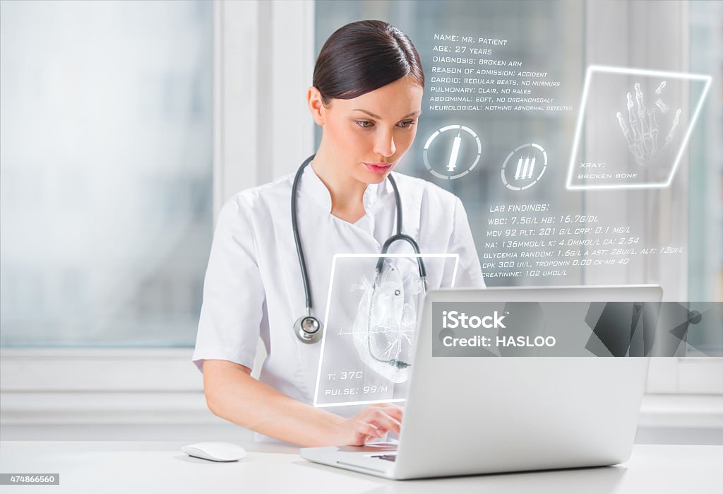 Pretty female medicine doctor working with modern computer interface Healthcare And Medicine Stock Photo