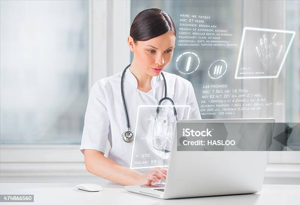 Pretty Female Medicine Doctor Working With Modern Computer Interface Stock Photo - Download Image Now