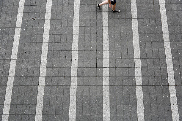 istock Man walking on the walkway bird perspective 474867116