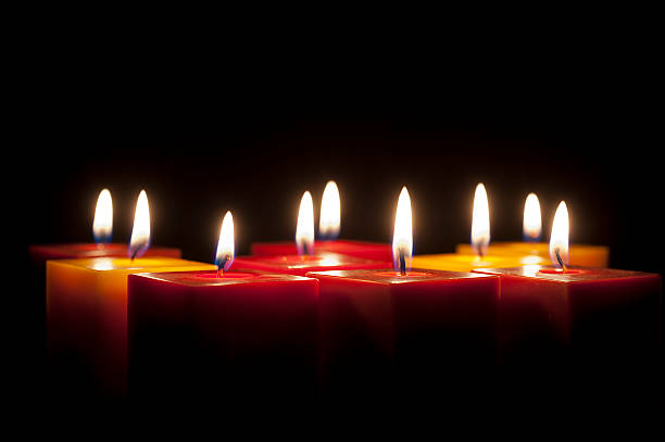 istock candles lighting in the darkness 474868246