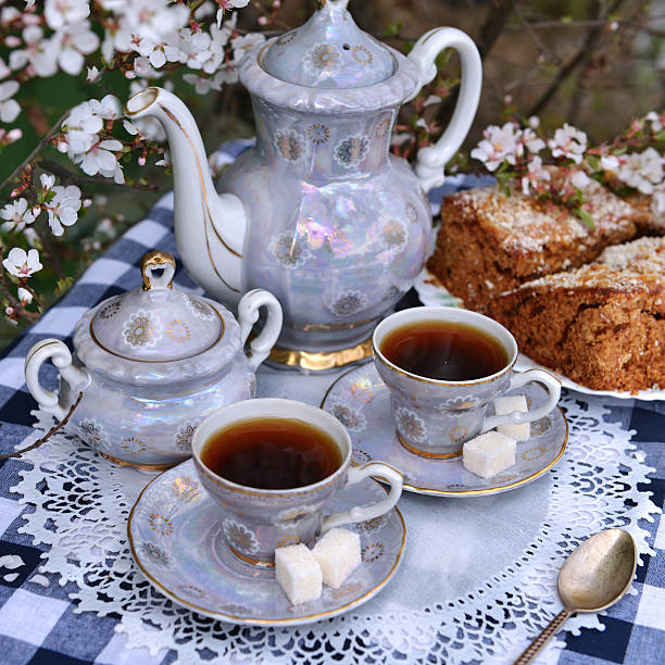 istock Still life with tea set and cake on white napkin 474868404