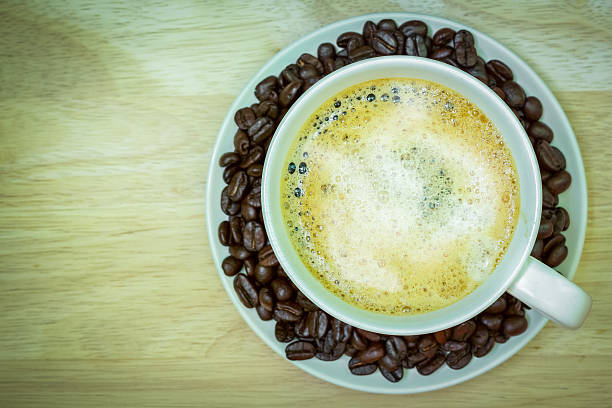 istock Coffee cup on wooden table. View from the top 474872870