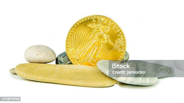 Golden American Eagle Coin With Grey Pebblestones Stock Photo - Download Image Now - 2015, Bank Deposit Slip, Coin