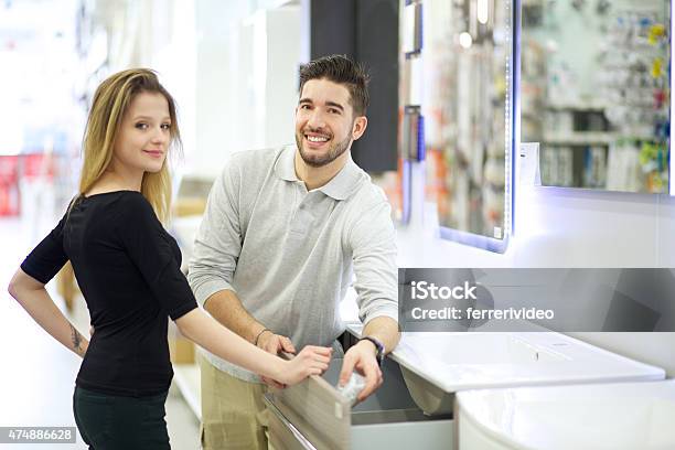 Couple At Store Stock Photo - Download Image Now - 2015, Adult, Beautiful People