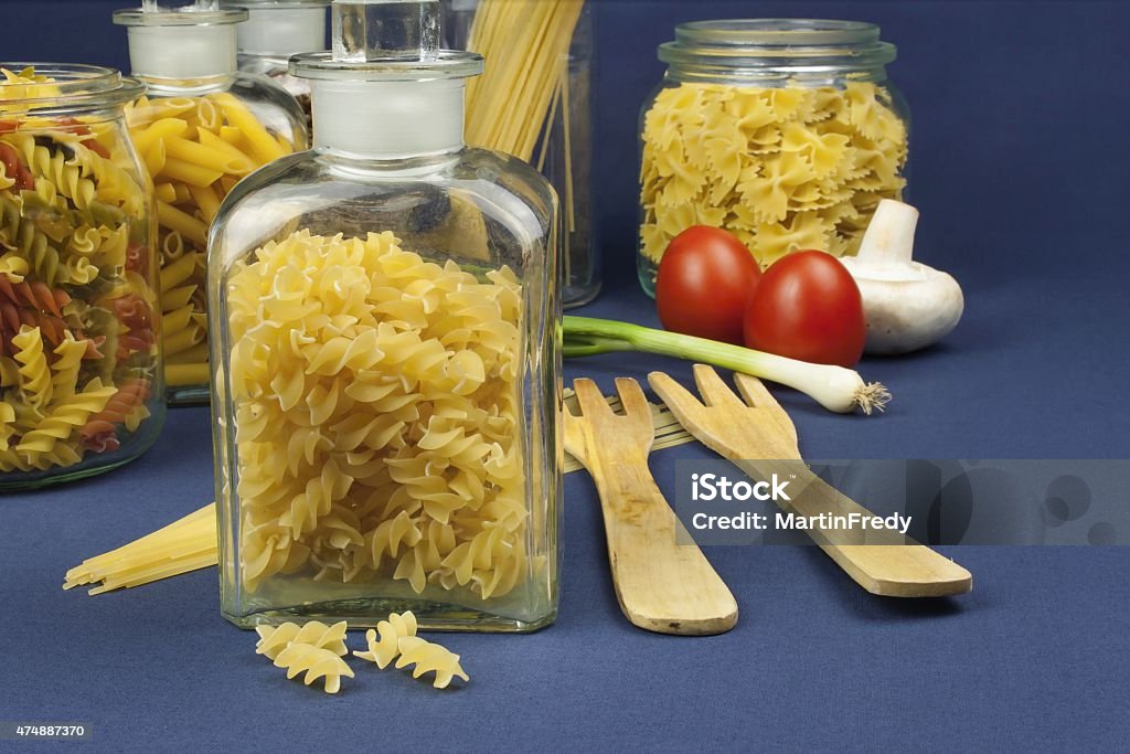 Various types of pasta on the table, homemade food preparation 2015 Stock Photo