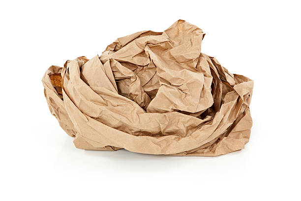 istock Crumpled brown paper isolated on white. 474887776