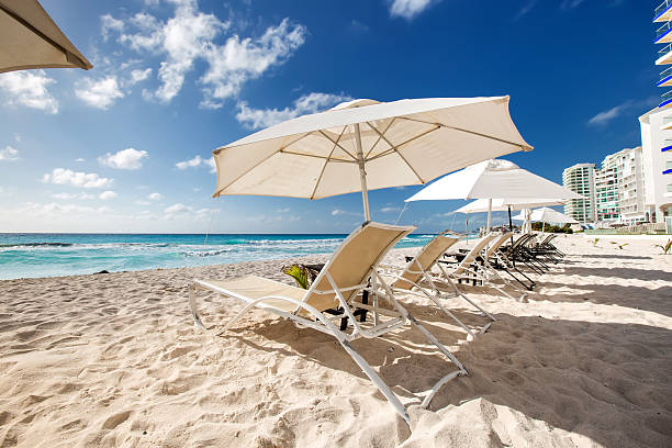 istock Beach with sun umbrellas and beds 474888426