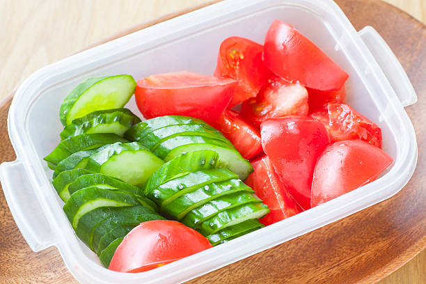 istock Slice cucumber  and slice tomato in plastic lunch box 474893924