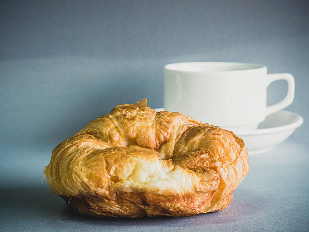 istock breakfast with croissants, cup of black coffee 474895915