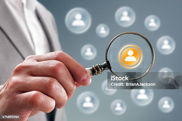 Search For Team Personnel Or Contacts Stock Photo - Download Image Now - Magnifying Glass, People, Magnification