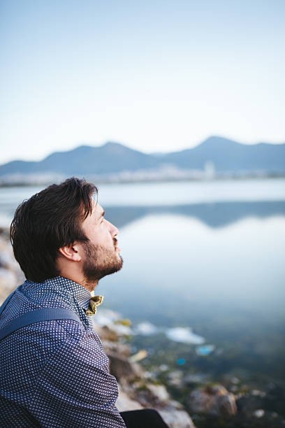 istock Portrait of young man looking away 474896020