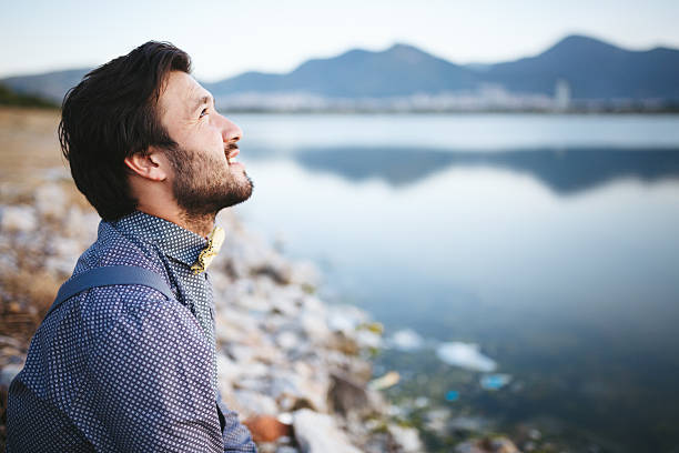 istock Portrait of young man looking away 474896024