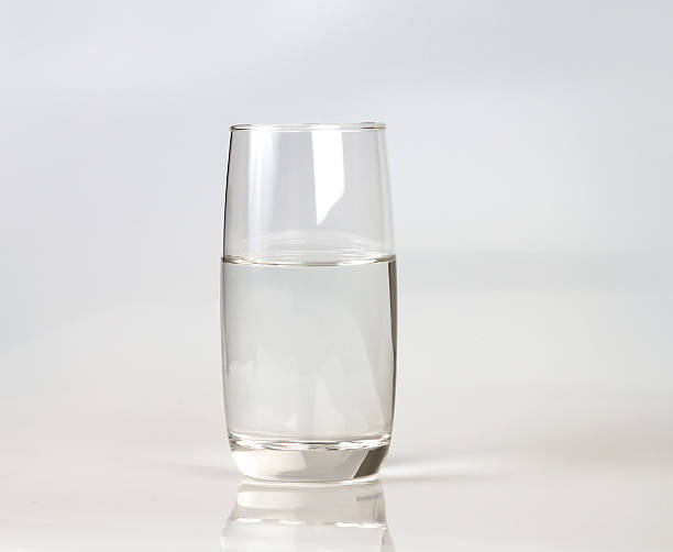 istock Glass of fresh drink water on grey backgrund 474896046