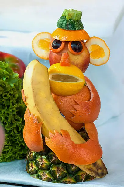 Photo of cute monkey made from fruits