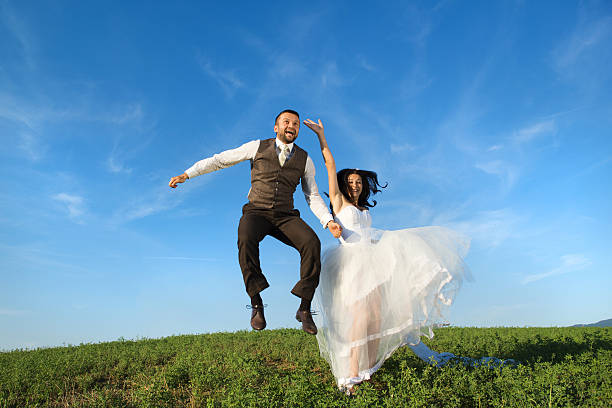 istock Newly married couple portrait with blue sky 474901307