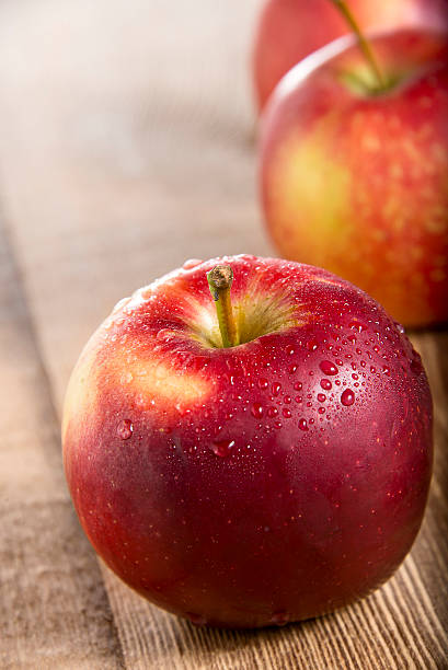 istock Red Apples on wooden 474902608