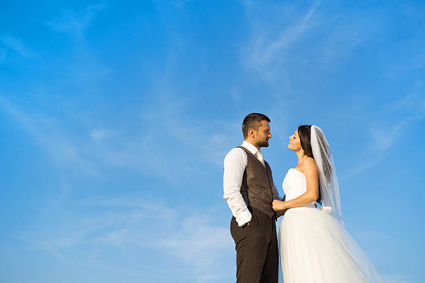 istock Newly married couple portrait with blue sky 474903801