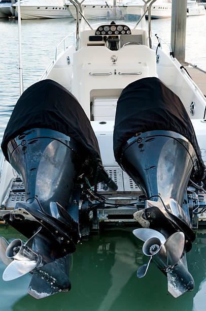 istock Small motorboat docking at the marina 474906132
