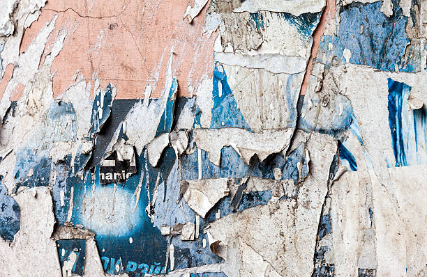 istock Wall with scraps of old paper as background 474906944
