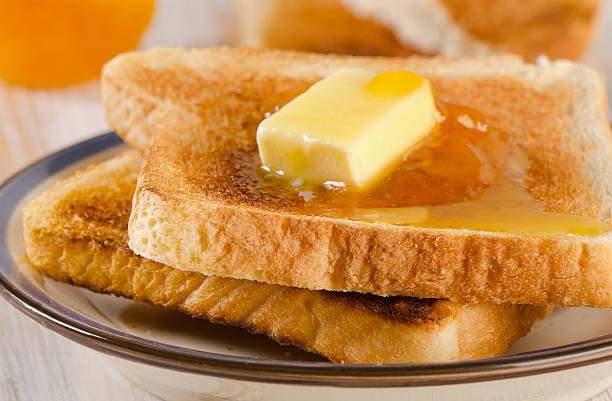 istock Slices toast bread on   wooden table 474908722