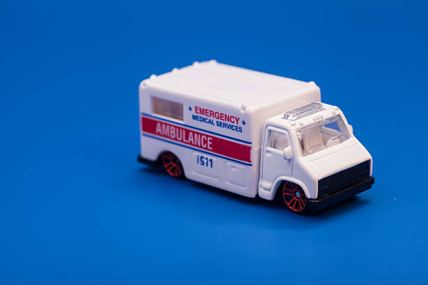 istock Toy ambulance car isolated on blue background 474912202