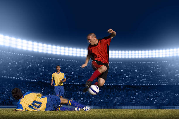 Soccer player jumping with ball Soccer player doing a manouver konwn as the bycicle that consists in passing over another player with the ball trapped in his legs. While another oponent looks surprised. international soccer event photos stock pictures, royalty-free photos & images