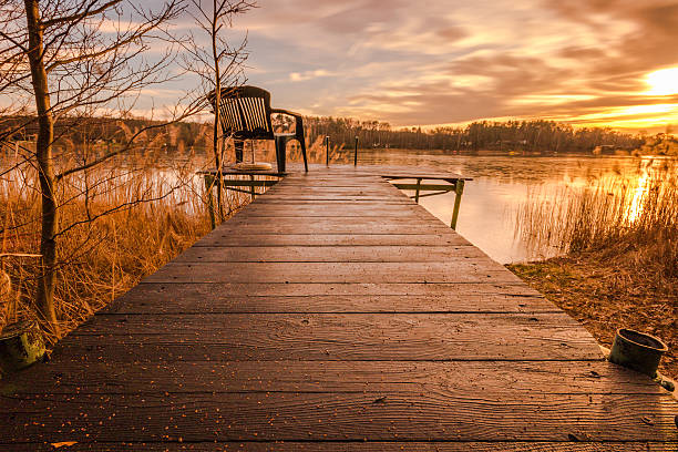istock Wooden Boardwalk Dock by Lake at Sunrise 474914517