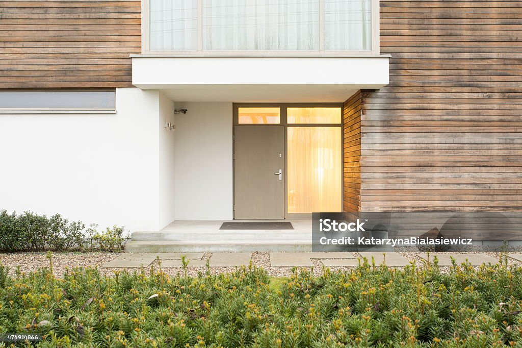 Front door Photo of front door in up-to-date residence Door Stock Photo