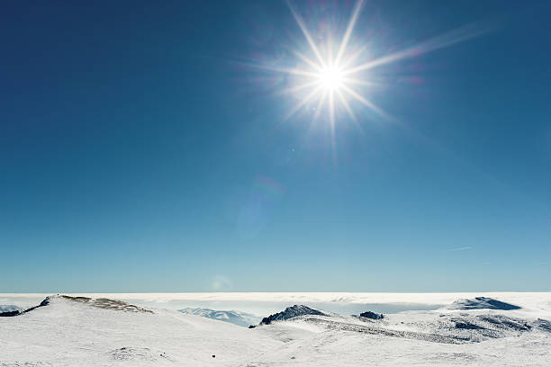 istock Sunshine over snowy mountains 474917694