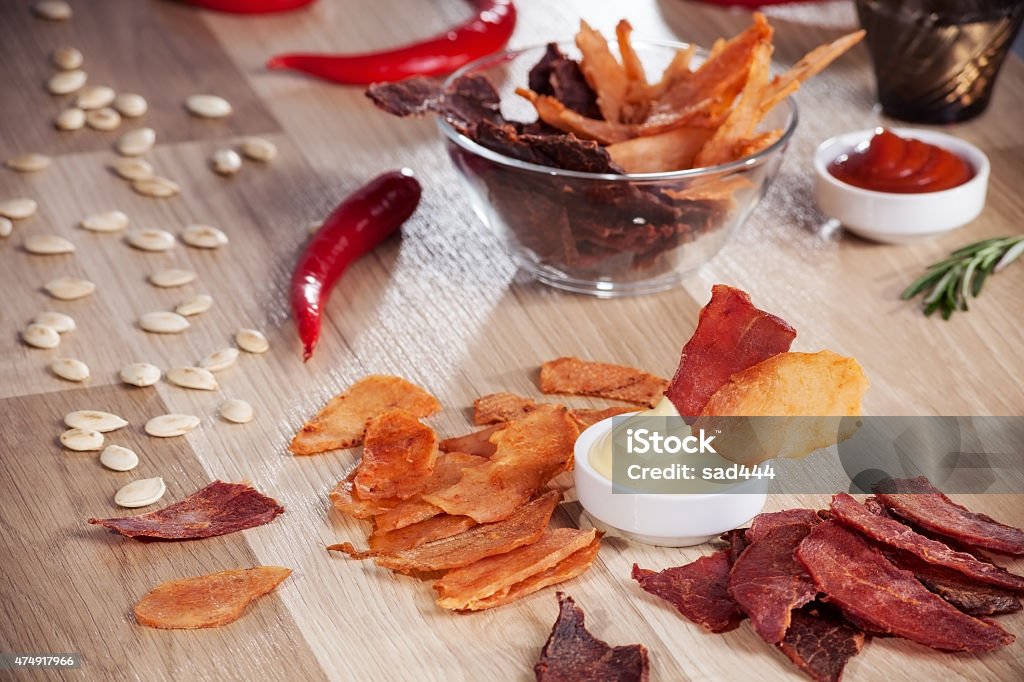 meat chips meat chips on a plate with pepper pumpkin seeds and pepper 2015 Stock Photo