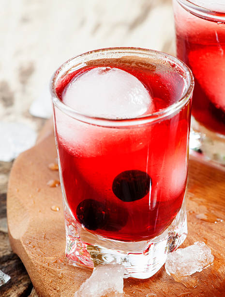 istock Red juice with ice in shape of hearts, selective focus 474918018