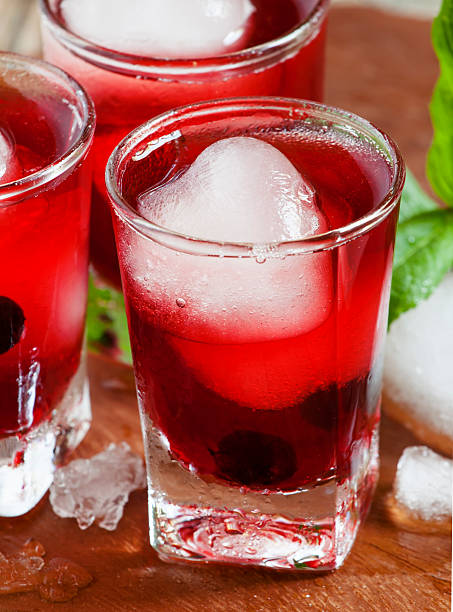 istock Red juice with ice in shape of hearts, selective focus 474918020