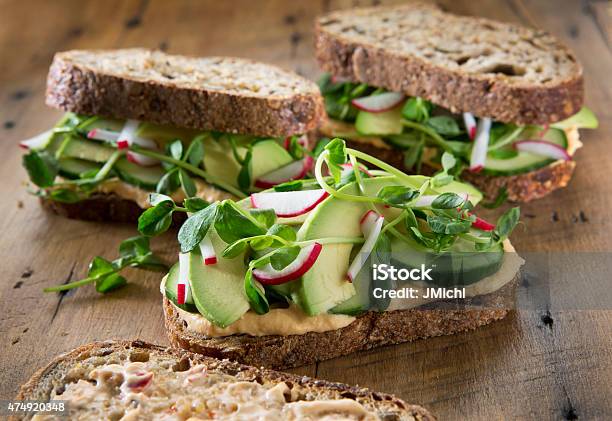 Vegetable Sandwichs On A Rustic Wood Background Stock Photo - Download Image Now - Sandwich, Hummus - Food, Vegetable