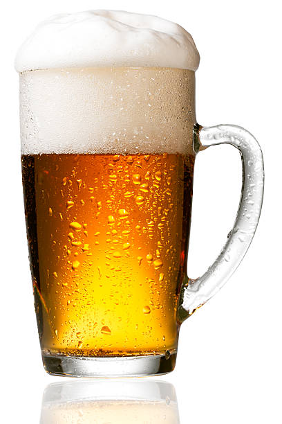 istock Mug beer with cap of foam isolated on white background 474920690